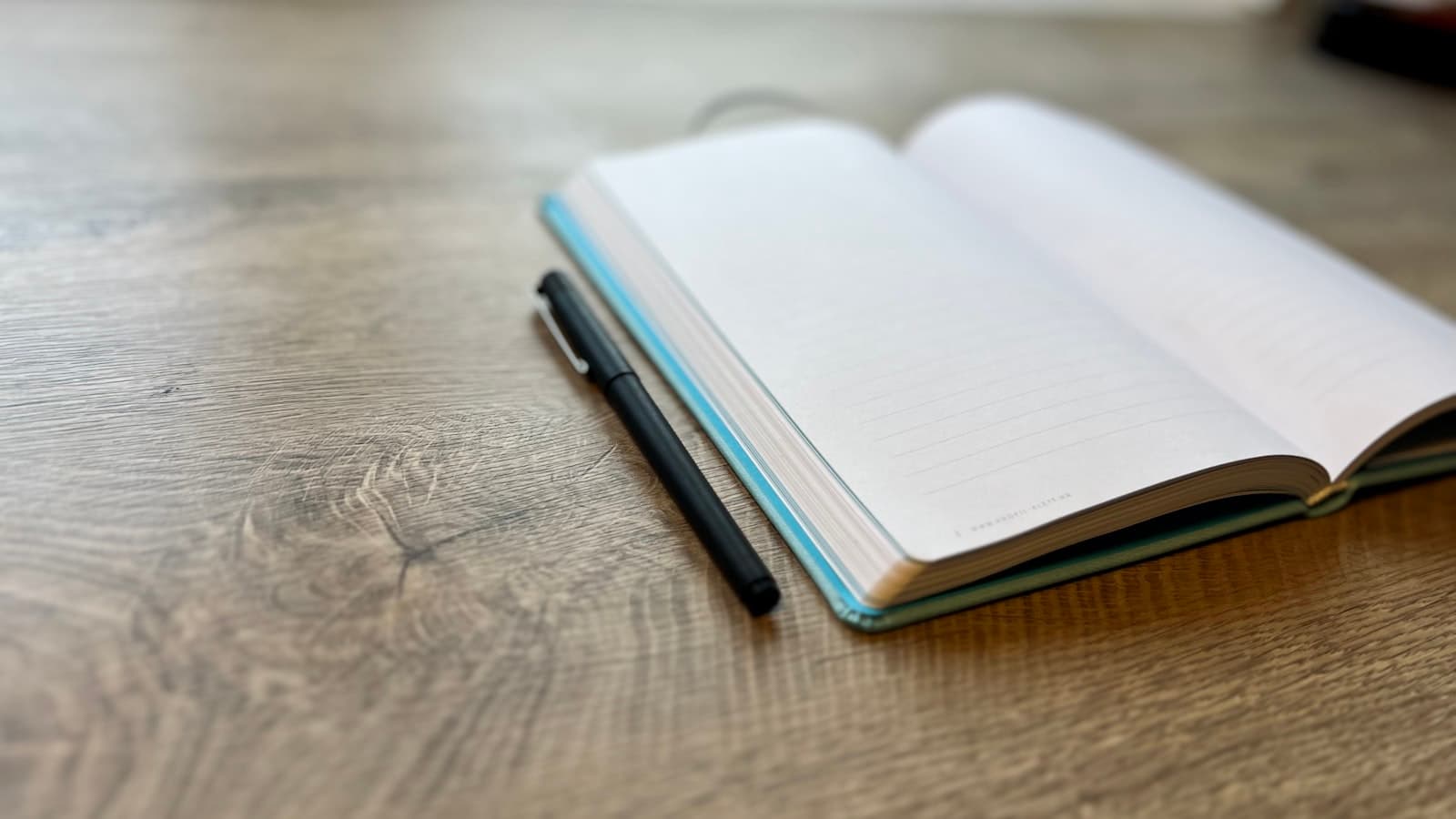 Building a second brain — a pen resting on an open notebook
