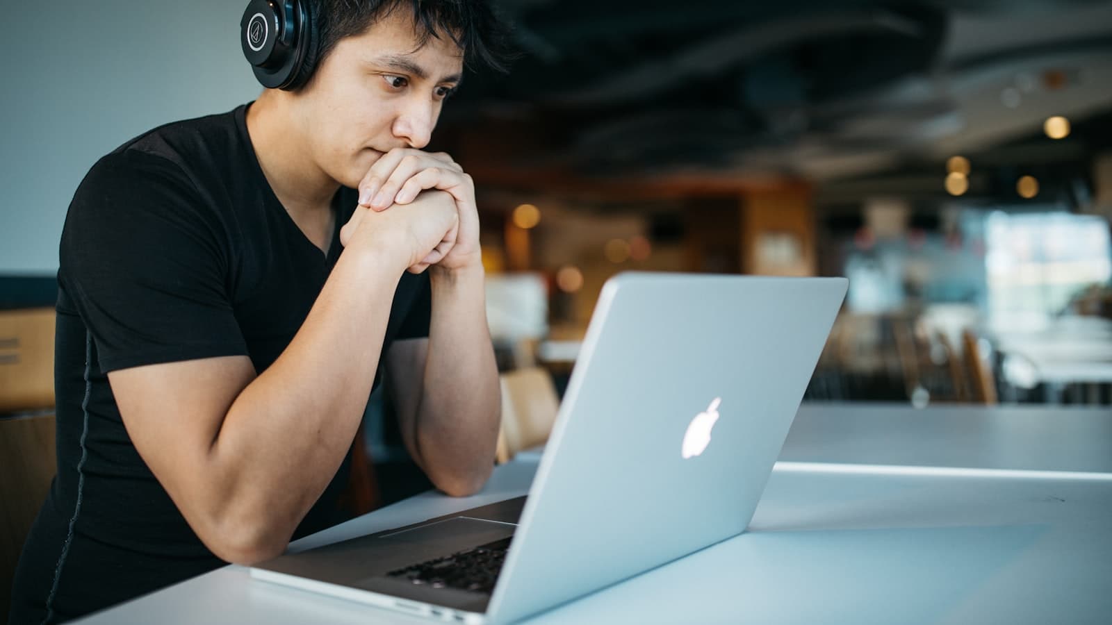 Learn anything faster with AI — a student with headphones and a laptop