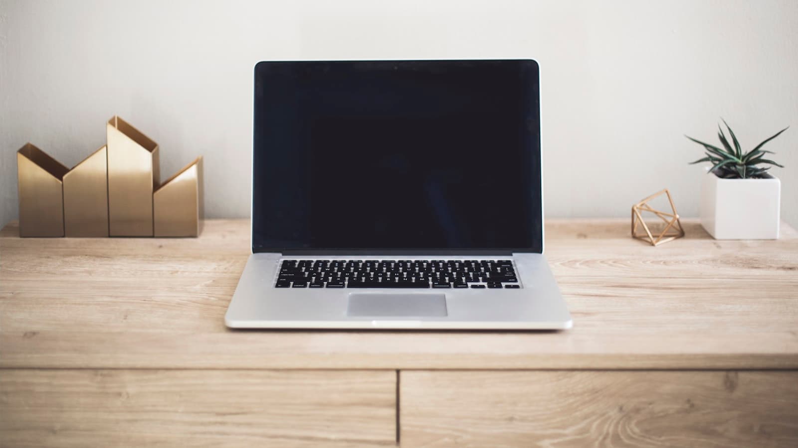How to start a blog in 2026 — a MacBook open on a desk