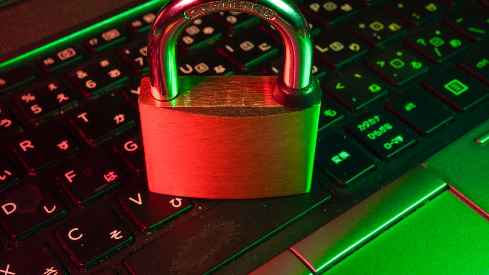 Cybersecurity explained — a red padlock on a computer keyboard