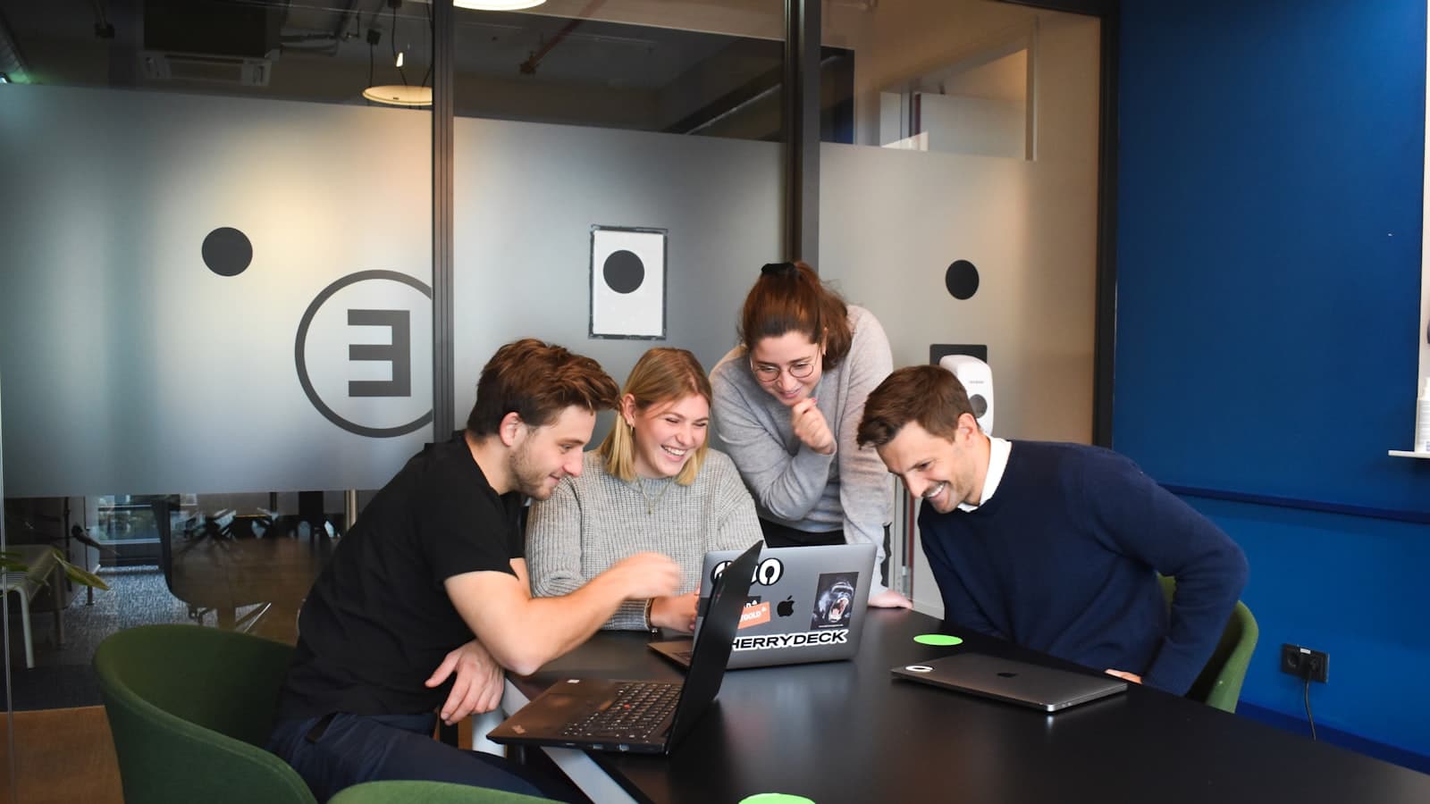 Best AI tools for marketers — a team working on laptops