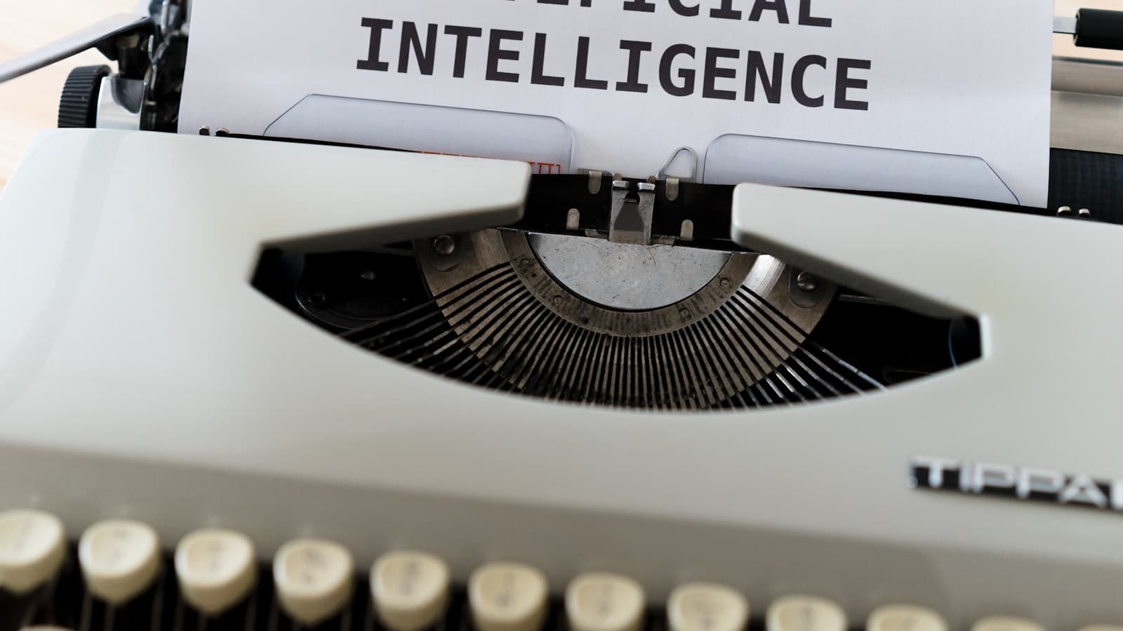 Fine-tuning vs prompting vs RAG — a typewriter with a sheet of paper