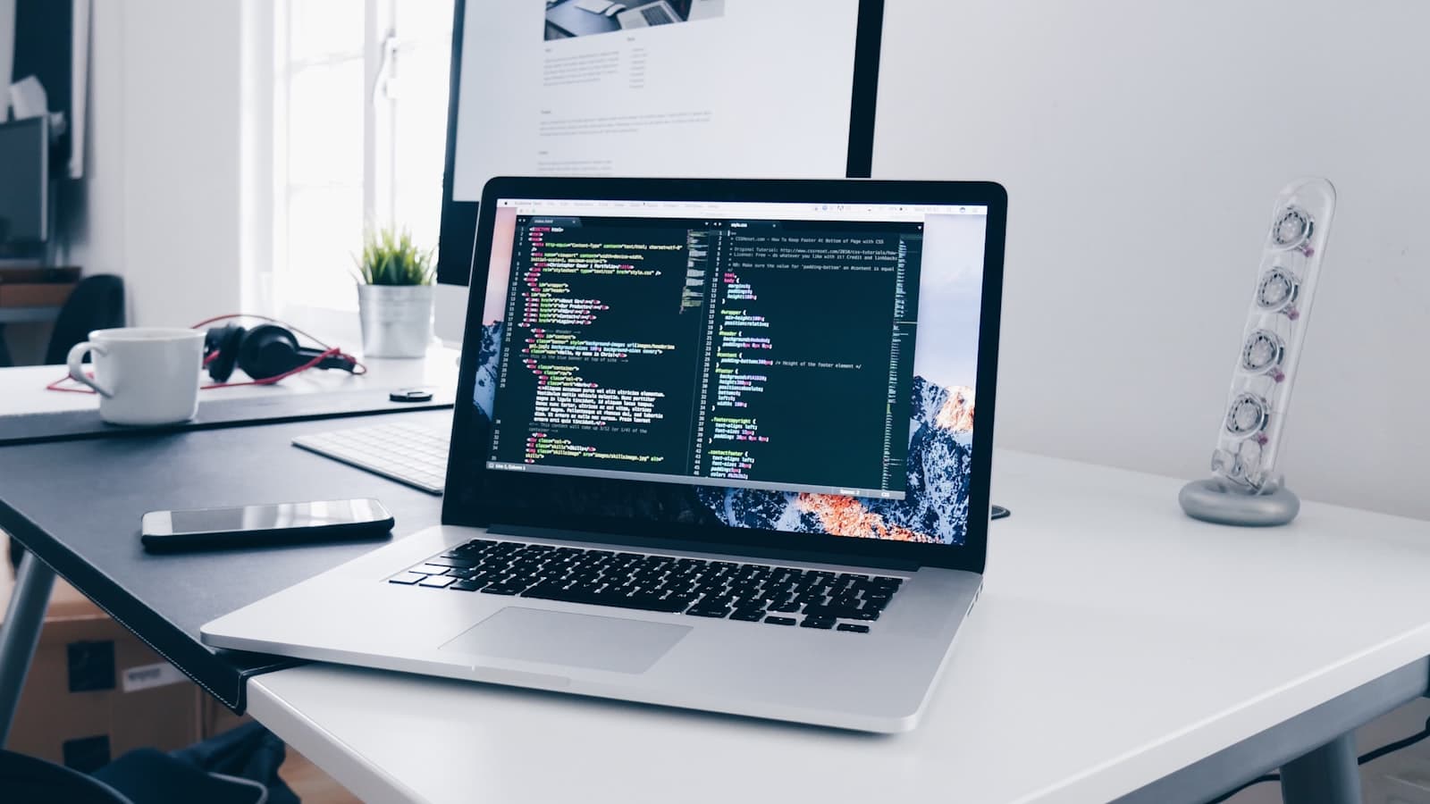 Build a portfolio website — a laptop showing code on a desk