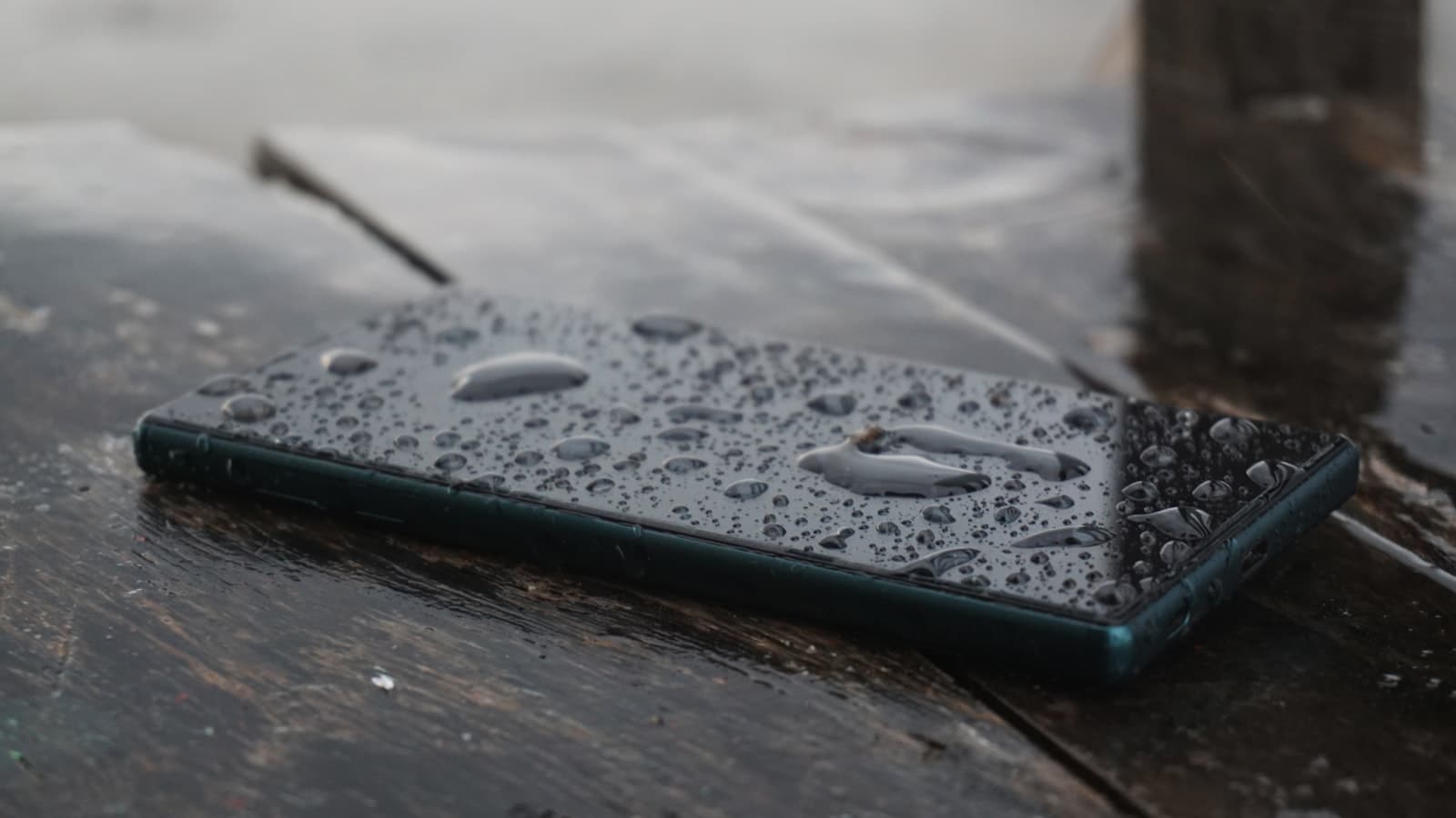 Doing a digital detox — a smartphone resting on a wooden surface
