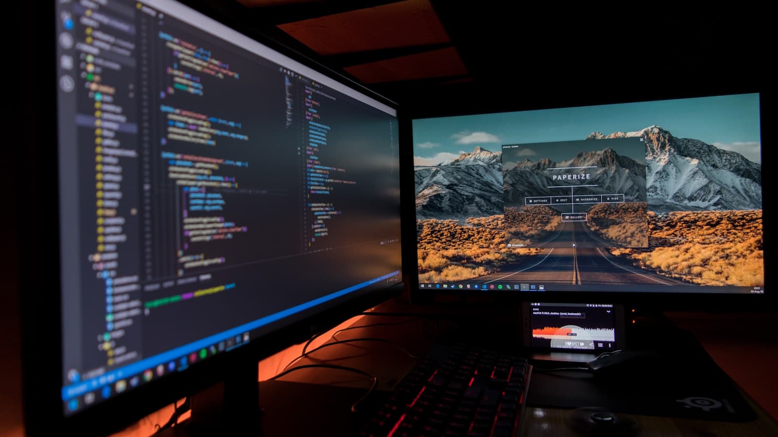 What is an API key — dual monitors displaying code